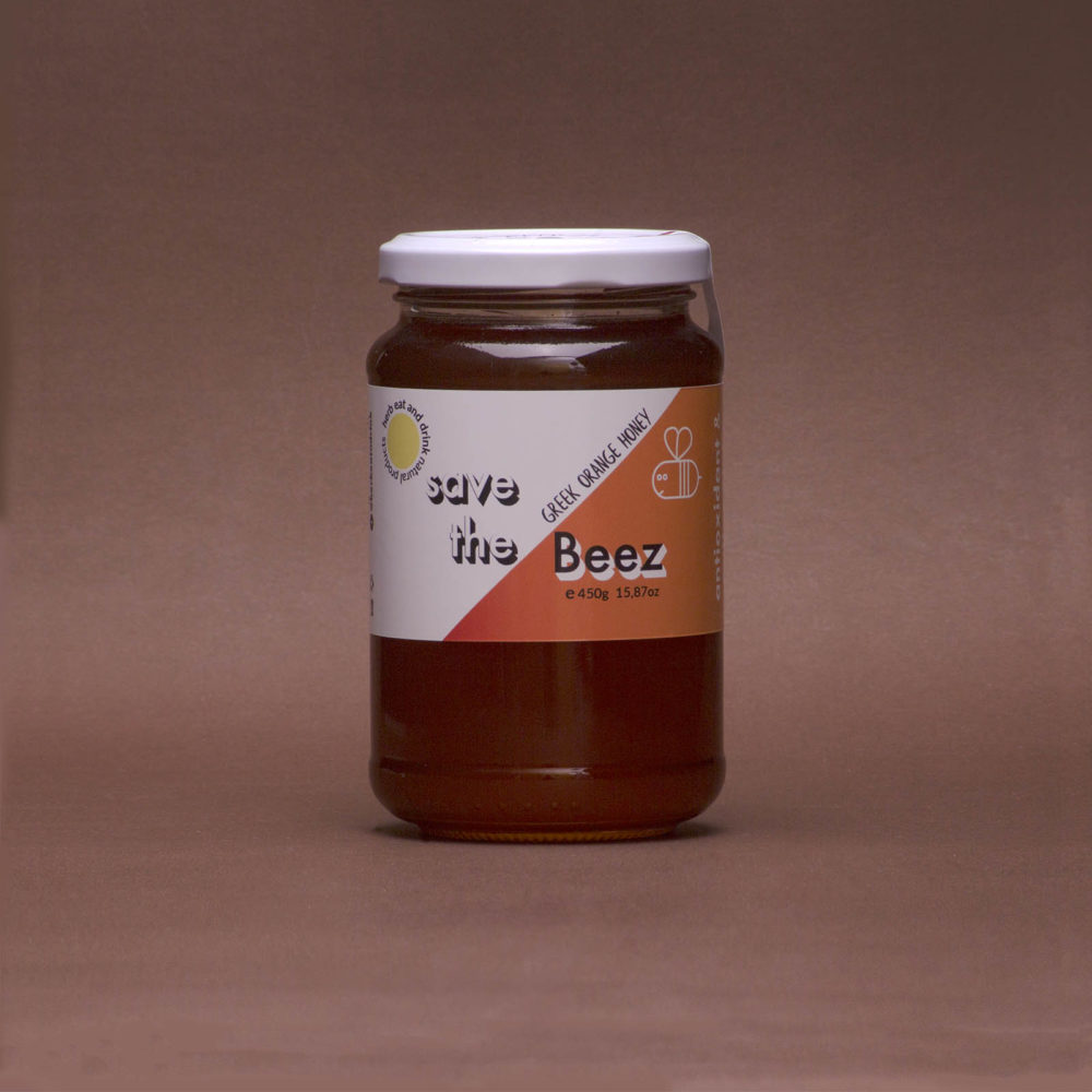 orange honey in a glass jar